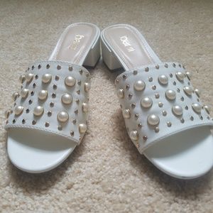 Slip on mules with pearl and gold detail